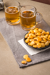 Image showing Tasty lupins and glass of beer