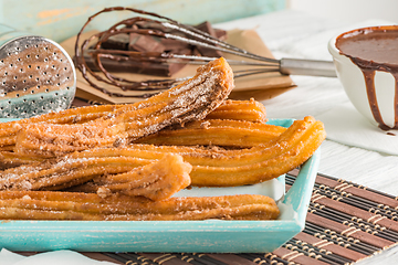 Image showing Traditional churros with hot chocolate 