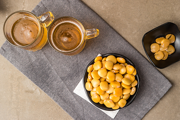 Image showing Tasty lupins and glass of beer