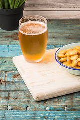 Image showing Tasty lupins and glass of beer