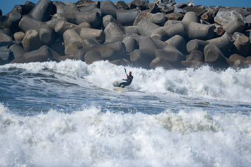 Image showing Kitesurfer riding ocean waves