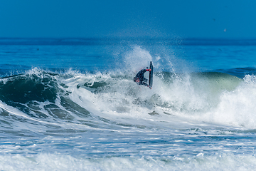 Image showing Bodyboarder surfing ocean wave