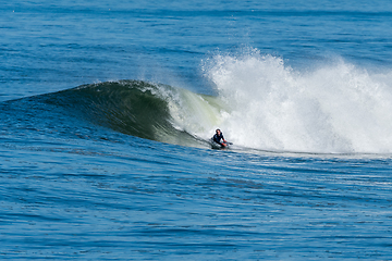 Image showing Bodyboarder surfing ocean wave