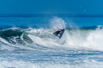 Image showing Bodyboarder surfing ocean wave