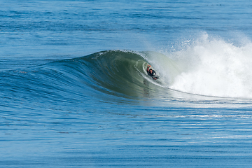 Image showing Bodyboarder surfing ocean wave