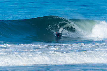 Image showing Bodyboarder surfing ocean wave