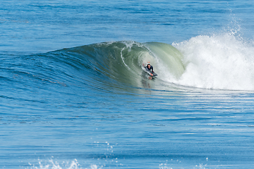 Image showing Bodyboarder surfing ocean wave