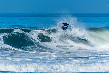 Image showing Bodyboarder surfing ocean wave