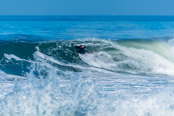 Image showing Bodyboarder surfing ocean wave