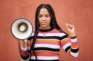 Image showing Megaphone, portrait or black woman protest with speech announcement for politics, equality or human rights. Feminist leader, revolution or gen z girl with sound device for justice on wall background