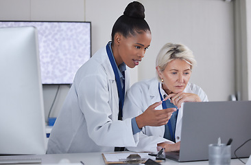 Image showing Teamwork, laptop and doctors planning in laboratory for medical research for science. Cooperation, collaboration and researchers, black woman and senior female helping, discussion or brainstorming.