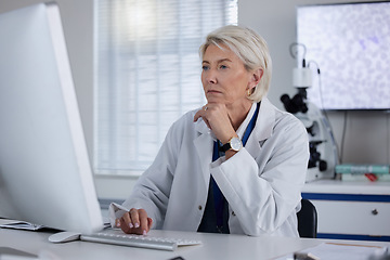 Image showing Science, computer and female scientist working on research, experiment or test for a project in lab. Technology, professional and senior woman scientific expert doing an analysis on pc in laboratory.