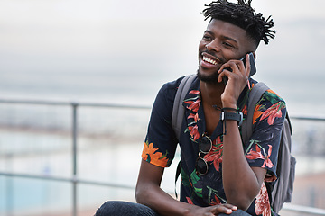 Image showing Phone call, communication and black man with a cellphone in the city while on an adventure. Happy, smile and African male on a mobile conversation with smartphone in town on a holiday or weekend trip