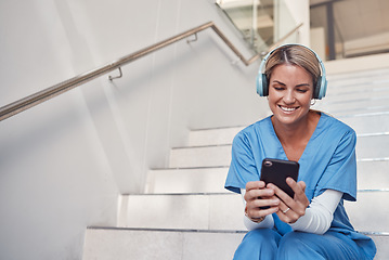 Image showing Doctor, phone and stairs for consultation, communication or video call outside hospital for health advice. Happy woman nurse smiling in healthcare with smartphone and headset for telemedicine