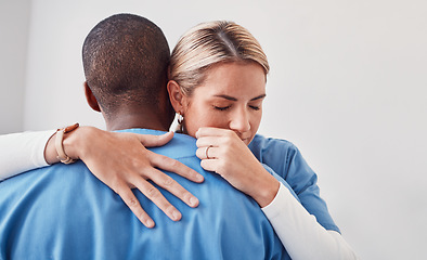 Image showing Comfort, support and doctors hugging in the hospital after the death of a patient in surgery. Healthcare, sad and medical workers embracing with care, love and compassion in the medicare clinic.
