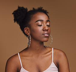 Image showing Makeup, beauty and black woman in studio for wellness, cosmetics and skincare on brown background. Glamour, aesthetic and girl relax with luxury, treatment and skin pamper routine while isolated