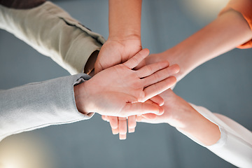 Image showing Team work, hands together and diversity of women in office feeling community, support and success. Trust, collaboration and teamwork of business people below with work cooperation and motivation