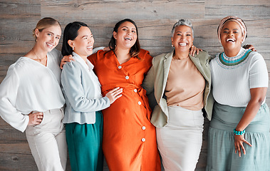 Image showing Happy, smile and portrait of a pregnant woman with her friends by a wood wall at her baby shower. Friendship, diversity and females supporting, loving and bonding with a lady with pregnancy together.
