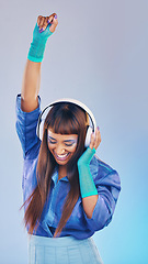 Image showing Future, dance and woman with headphones, celebration and excited on studio background. Fashion, female dancer and lady with trendy outfit, edgy and achievement with girl, groove and streaming music
