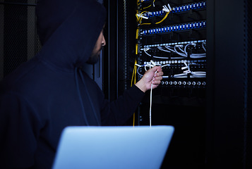 Image showing Thief, programming and hacker stealing software, website data and information on server on a laptop. Connection, criminal and man hacking into a network for hardware, coding and cyber crime at night