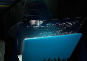 Image showing Cyber security, crime and hacker with laptop typing in data center, stealing sensitive digital information and coding. Technology, software and man hacking in database to update ransomware on website