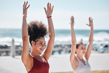 Image showing Yoga, exercise and beach with woman friends outdoor together in nature for wellness training. Fitness, chakra or zen with a female yogi and friend outside for a mental health workout by the ocean