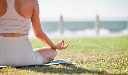 Image showing Yoga, meditation and hands of woman on grass for healthy lifestyle, body wellness and cardio workout. Sports, pilates training and girl doing exercise for mindfulness, spiritual zen and peace in park