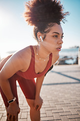 Image showing Fitness, music and tired with a black woman runner on the promenade for cardio or endurance training. Exercise, running and earphones with a sports person feeling exhausted during her workout