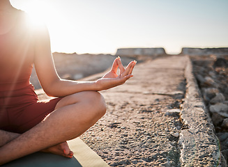 Image showing Woman, hands and meditation in yoga on rock for spiritual wellness or peaceful exercise in nature. Hand of female yogi in calm meditating for zen workout, relax or awareness by ocean coast on mockup