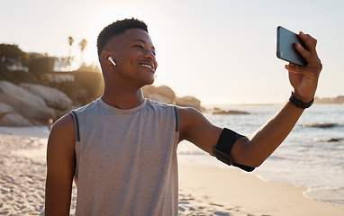 Image showing Sports, fitness selfie and black man at beach for social media, video call or training blog update on running goals. Athlete, runner or african person with exercise, cardio or workout profile picture