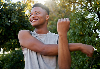 Image showing Stretching, thinking and black man in nature for running, fitness and sports in Morocco. Runner, training and athlete with a warm up to start with exercise, cardio and outdoor sports in a park