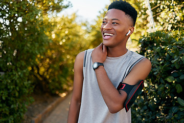 Image showing Exercise, black man outdoor and training for fitness, wellness and happiness for motivation. African American male, guy and athlete with smile, workout and performance for cardio, energy and power