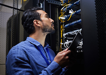 Image showing Tablet database, server room and engineer man looking at connection cables for maintenance or software update at night. Cybersecurity wire, it programmer and male with tech for data center networking