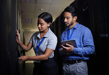 Image showing Engineer teamwork, server room and woman opening panel for maintenance or repairs at night. Cybersecurity, programmers and female with man holding tablet for software or networking at data center.