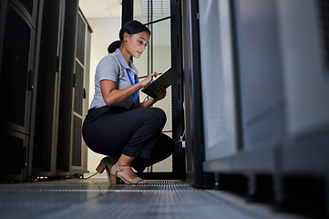 Image showing Engineer, server room and woman with tablet for database connection cable, maintenance or software update at night. Cybersecurity, it and female coder with technology for networking in data center.