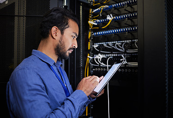 Image showing Database tablet, server room and engineer man looking at research for maintenance or software update at night. Cybersecurity, it programmer or male coder with technology for networking in data center