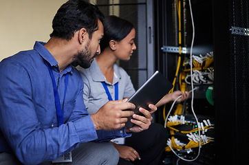 Image showing Engineer teamwork, server room and tablet for connection cable, maintenance or software update at night. Cybersecurity wire, programmers or man and woman with technology for networking in data center