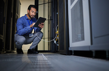 Image showing Engineer, server room and man with tablet for database connection cable, maintenance or software update at night. Cybersecurity wire, it and male coder with technology for networking in data center.