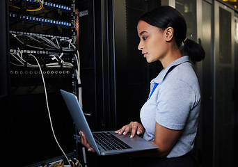 Image showing Engineer, laptop database and woman in server room for software update or maintenance at night. Cybersecurity coder, cloud computing and female programmer with computer for networking in data center.