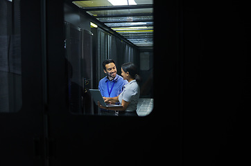 Image showing Man, woman or laptop in server room, IT engineering or software programming for cybersecurity, analytics or database safety. Smile, happy or data center people on technology in teamwork collaboration