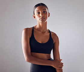 Image showing Portrait, fitness and young woman isolated on studio background for health, wellness and training mockup. Confident indian person, athlete or model with sports fashion, workout and exercise for body