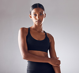 Image showing Portrait, fitness and beauty woman isolated on studio background for health, wellness and training mockup. Confident indian person, athlete or model with sports fashion, workout and exercise for body