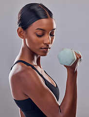 Image showing Woman, bicep and dumbbell training in studio for strong body, action and wellness goals. Indian female, bodybuilder and weights of fitness, power exercise and muscle energy for healthy sports workout