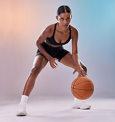 Image showing Portrait, basketball player or black woman isolated on gradient background in action, challenge and body workout. Indian person or fitness model in studio training, exercise and ball in focus mindset