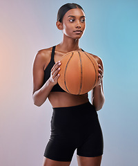 Image showing Fitness, basketball and sports woman isolated on gradient background for workout, training and body exercise. Young Indian athlete, person or model in studio with ball in focus. game or cardio health