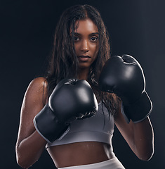 Image showing Boxing champion, portrait and woman on black background for sports, strong focus and mma training. Female boxer, gloves and fist fight of impact, energy and warrior power for studio fitness challenge