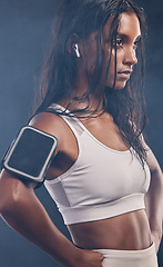 Image showing Black woman profile, studio and training with earphones for fitness, phone and music for focus mind. Gen z girl, personal trainer and smartphone for vision, motivation and mindset for workout goal