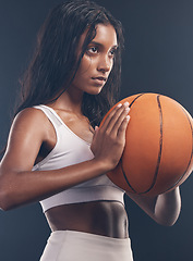 Image showing Basketball player, sports exercise and studio woman for wellness challenge, practice game or fitness competition. Health performance, training workout and athlete model isolated on dark background
