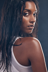 Image showing Health, sweat and portrait of a woman for fitness isolated on a dark background in a studio. Gym, sports and face of an Indian athlete with commitment to cardio training, exercise and workout