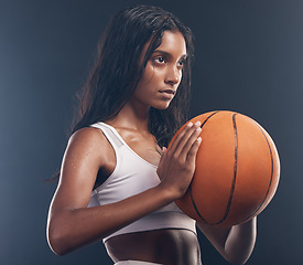 Image showing Basketball player, sports training and studio woman for wellness challenge, practice game or fitness competition. Performance workout, health exercise and athlete model isolated on dark background
